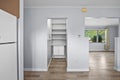 Kitchen with a white refrigerator and a white pantry Royalty Free Stock Photo
