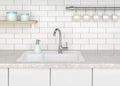 Kitchen with white sink and kitchen faucet
