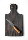 Kitchen wooden board with knife on white background