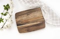 Kitchen wooden cutting board top view, serving dish empty space design, tableware on white. Food advertisement Royalty Free Stock Photo