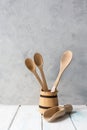 Kitchen wooden tools, spoons in jar on gray background Royalty Free Stock Photo