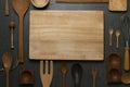 Kitchen wooden utensils for cooking on the black table backcround, food prepare concept