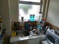 Kitchenette in an office on display - untidy basin Dirty space