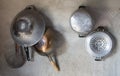 Kitchenware hang on cement wall Royalty Free Stock Photo