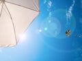 Kite background. Colorful high flying toy. Air kite fly on blue wind sky. Rainbow kite in summer clouds. Festive Royalty Free Stock Photo