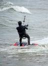 Kite boarder braces for a big wave