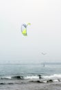 Kite boarder on lake Michigan in the fog