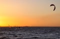 Kite boarder and wind surfer at sunset