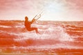 Kite boarding. Kitesurf freestyle at sunset. Toned Royalty Free Stock Photo