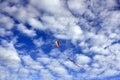 Kite in a cloudy blue sky