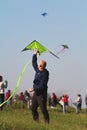 Kite festival - a guy with green kite
