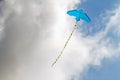 Kite flying against the blue sky on a sunny day Royalty Free Stock Photo