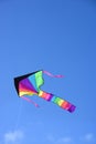 Kite flying in blue sky. Royalty Free Stock Photo