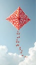 Kite Flying in Blue Sky with Decorative Design and Bird-shaped Streamer Royalty Free Stock Photo
