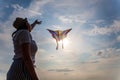 Kite in hand against the blue sky in summer, flying kite launching, fun summer vacation, freedom Royalty Free Stock Photo