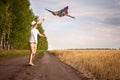 Kite in hand against the blue sky in summer, flying kite launching, fun summer vacation, under the field, freedom Royalty Free Stock Photo