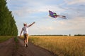 Kite in hand against the blue sky in summer, flying kite launching, fun summer vacation, under the field, freedom Royalty Free Stock Photo