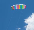 Kite parachute flying in the sky among the clouds Royalty Free Stock Photo