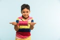 Indian small kid or boy holding spindal or chakri on Makar Sankranti festival, ready to fly Kite Royalty Free Stock Photo