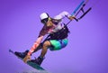 Kite rider close up portrait. Professional kite boarding rider sportsman with kite in sky jumps high acrobatics kiteboarding air Royalty Free Stock Photo