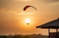 A kite soars in the sky above the roofs of houses with a contour light. A summer day Royalty Free Stock Photo