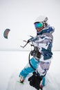 Kite surfer being pulled by his kite across the snow Royalty Free Stock Photo
