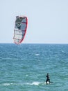 Kite surfer on blue waters of Atlantic Ocean in Portugal