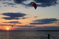 A kite surfer brings in his kite at the end of the day Royalty Free Stock Photo