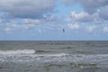 Kite surfer enjoys a brisk wind on the Baltic seashore in Pavilosta