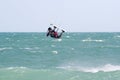 Kite surfer flying over a choppy sea Royalty Free Stock Photo