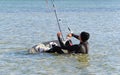 Kite Surfer gets up on the board Royalty Free Stock Photo