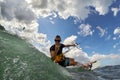 Kite surfer jumps with kiteboard in transition Royalty Free Stock Photo