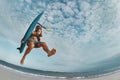 Kite surfer jumps with wakeboard Royalty Free Stock Photo