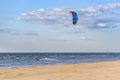 Kite surfer making tricks nea Baltic sea coast line at Riga, Latvia