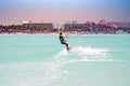 Kite surfer on Palm Beach at Aruba island in the Caribbean at sunset Royalty Free Stock Photo