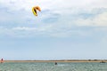 Kite surfer riding with kiteboard on el Portil beach, Huelva