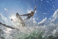 Kite surfer jumps with kiteboard Royalty Free Stock Photo
