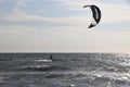 kite surfer sailing across the bay