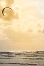 A kite surfer silhouette who sails on a Danish beach at sunset alone Royalty Free Stock Photo