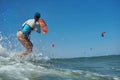 Kite surfer woman jumps with kiteboard Royalty Free Stock Photo