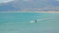 Water sports at the turquoise Mediterranean Sea. Kite surfing holiday. Southern Spain,Costa del Sol in the distance