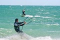 Kite surfers on a choppy sea Royalty Free Stock Photo