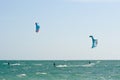 Kite surfers on a choppy sea Royalty Free Stock Photo