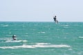 Kite surfers on a choppy sea Royalty Free Stock Photo