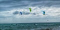 Kite surfers, rough sea and stormy sky Royalty Free Stock Photo