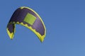 Kite surfers sail in a very blue sky Royalty Free Stock Photo