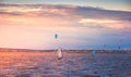 Kite Surfers and Wind Surfer at Sunset Royalty Free Stock Photo