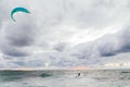 Kite surfing athlete riding waves in storm Royalty Free Stock Photo