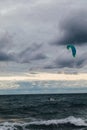 Kite surfing athlete riding waves in storm Royalty Free Stock Photo
