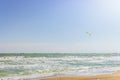 Kite surfing on beach with trade ships on horizon. Active lifestyle. Extreme sports concept Royalty Free Stock Photo